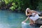 Girl squirting water at the lake