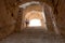 Girl on the stairs in the Amphitheatre of El Jem, Tunisia