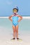 Girl Standing On Beach Wearing Snorkel And Flippers
