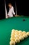 Girl standing behind billiards table