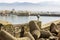 Girl standing on the breakwater against the fortress and ships in the port of Heraklion in Crete