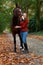 Girl standing brown mare horse avenue lane forest