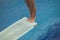 Girl standing on diving board