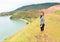 Girl standing high above bay