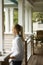 Girl standing on porch.