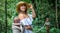 Girl standing on the rope bridge