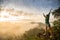 Girl standing on top of the mountain