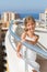 A girl stands on the balcony of the hotel