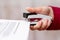 Girl stapler fastens sheets of paper documents in the office_