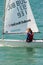 Girl - steering a sailing yacht in the bay of of Pomorie, Bulgaria