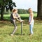 Girl stepping on iron pillar