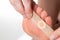 A girl sticks a medical plaster for plantar warts on her leg. Callus treatment. Copy space for text