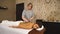 Girl on a stone therapy, hot stone massage