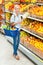 Girl at the store choosing vegetables hands cabbage