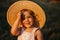 Girl in a straw hat in the fields. Portrait of a smiling girl. Baby laughs. Adorable baby girl