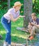 Girl in straw hat trying roasted food nature background. Delicious picnic food. Tips every camper should know about