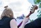 Girl at a street concert outdoors playing the contrabass, a musical instrument