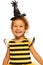 Girl in striped bee costume wearing spider hat