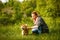 Girl stroking a dog Shiba Inu.