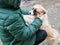 Girl stroking a puppy on the street. winter and pets. Teenager girl hug puppy shepherd dog close up photo