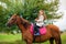 A girl strolls on her horse, active rest