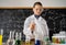 Girl student conducting chemical experiments in school laboratory, scientific experience in chemistry class for