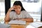 Girl student studying hard feeling stressed tired exhausted bored. children education