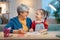 Girl studying with grandma