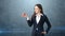 Girl in suit holds bright vibrant apple in hand, symbolising new ideas and fresh concepts or healthy lifestyle in office