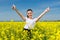 Girl in suit at yellow flower field show best gesture