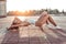 Girl in summer in city, lies on longboard skateboard, long hair, sunglasses white body swimsuit sneakers, free space for