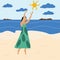 A girl in a summer green dress on the beach stretches her hands to the sun