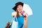 A girl in a summer hat holding a passport, an online plane ticket and a medical mask, ready for vacation. Travel during the