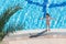 Girl sunbathing on the edge of the pool