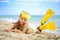 Girl sunbathing in mask and fins for scuba diving