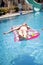 Girl sunbathing on a mattress