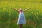 Girl surrounded by rapeseed flowers