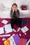 Girl surrounded by schoolwork