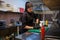 Girl sushi chef prepares food in the kitchen at restaurant