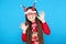 Girl in sweater and christmas eyeglasses