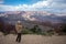 girl with sweatshirt and hoodie taking photos of the landscape of the Grand Canyon