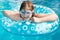 Girl in swim goggle on swimming circle