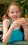 Girl in swim pool eating bread