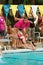 Girl Swimmer Dives Into Pool To Swim Relay Race