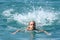 Girl swimming in blue sea
