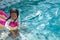 A girl swimming in the pool Joyfully.
