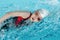 Girl swimming stroke or crawl in pool