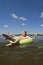 A girl swims in a yellow inflatable circle on the lake.