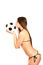 girl in a swimsuit holding and kissing a soccer ball on a w