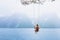 Girl on swing in Norway, happy dreamer, inspiration background